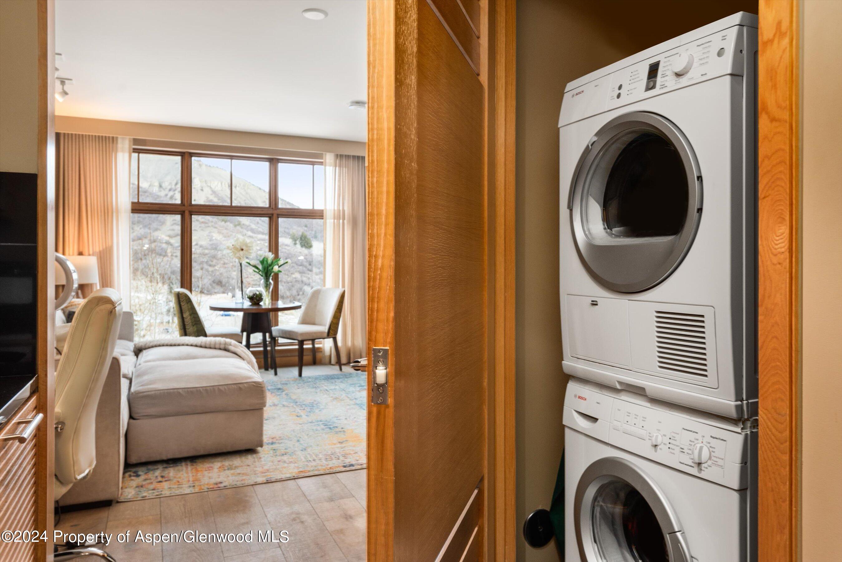 130 Wood Road, Unit 514 Snowmass Village, CO 81615 - Photo 10 of 11 a bedroom with a bed and glass window