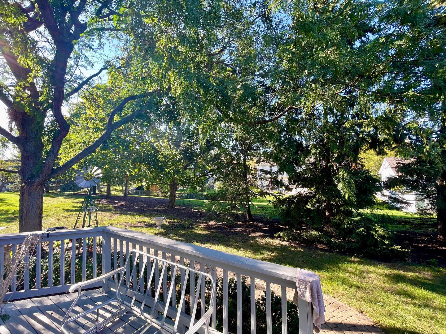 923 Heathrow Lane Naperville, IL 60540 - Photo 4 of 4 a view of balcony with wooden floor and fence