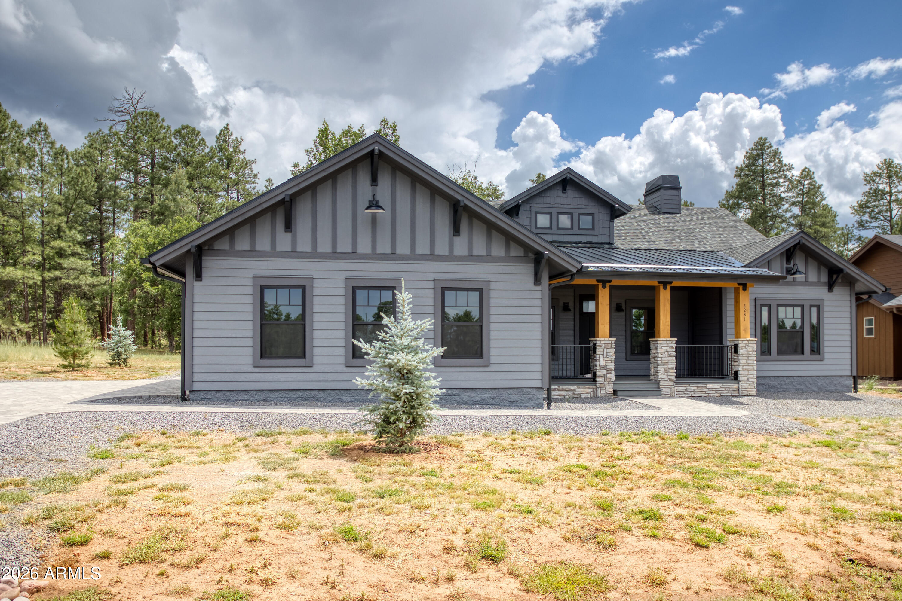 a front view of house with yard outdoor seating and barbeque oven