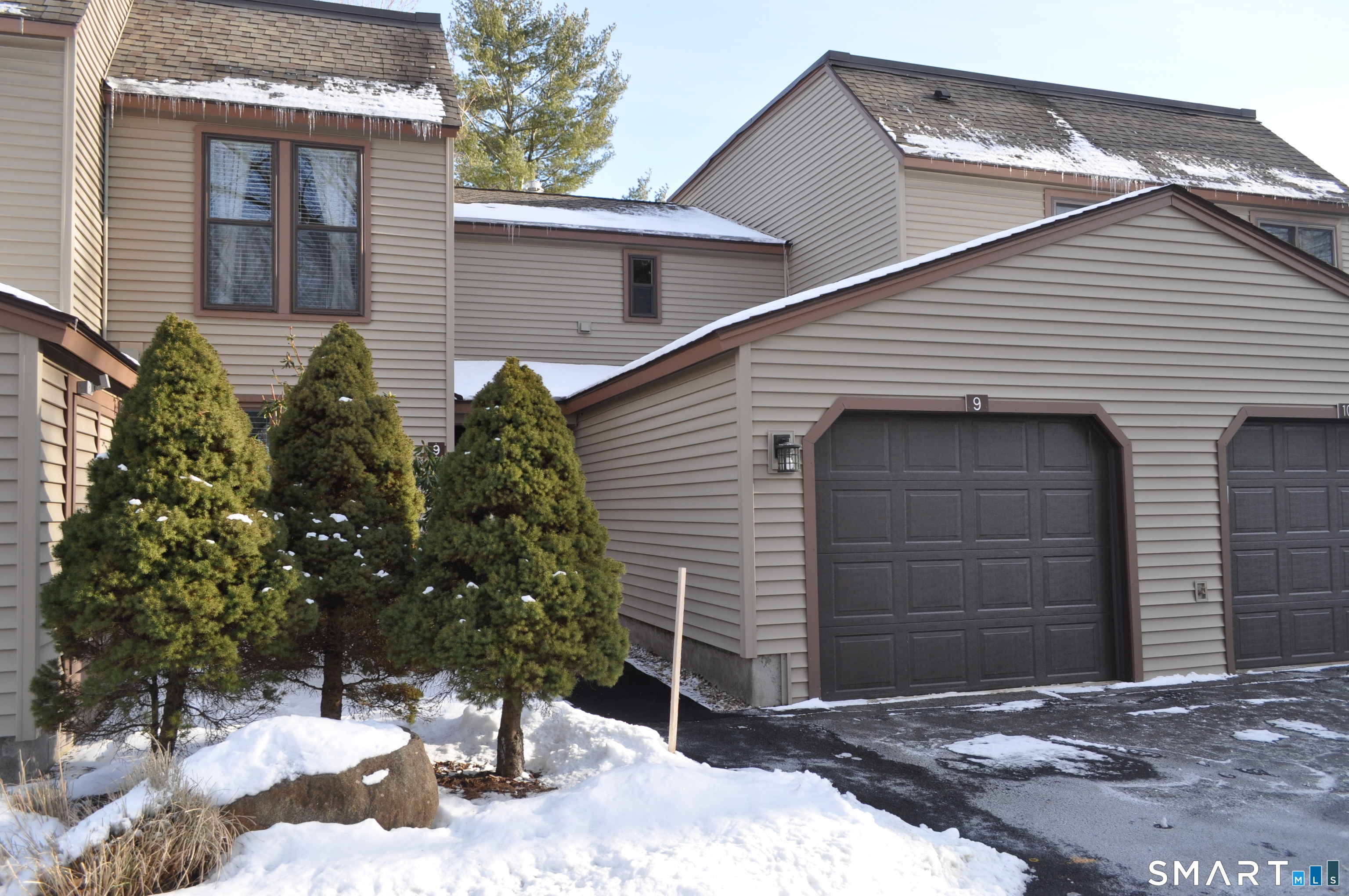 a view of a house with a tree