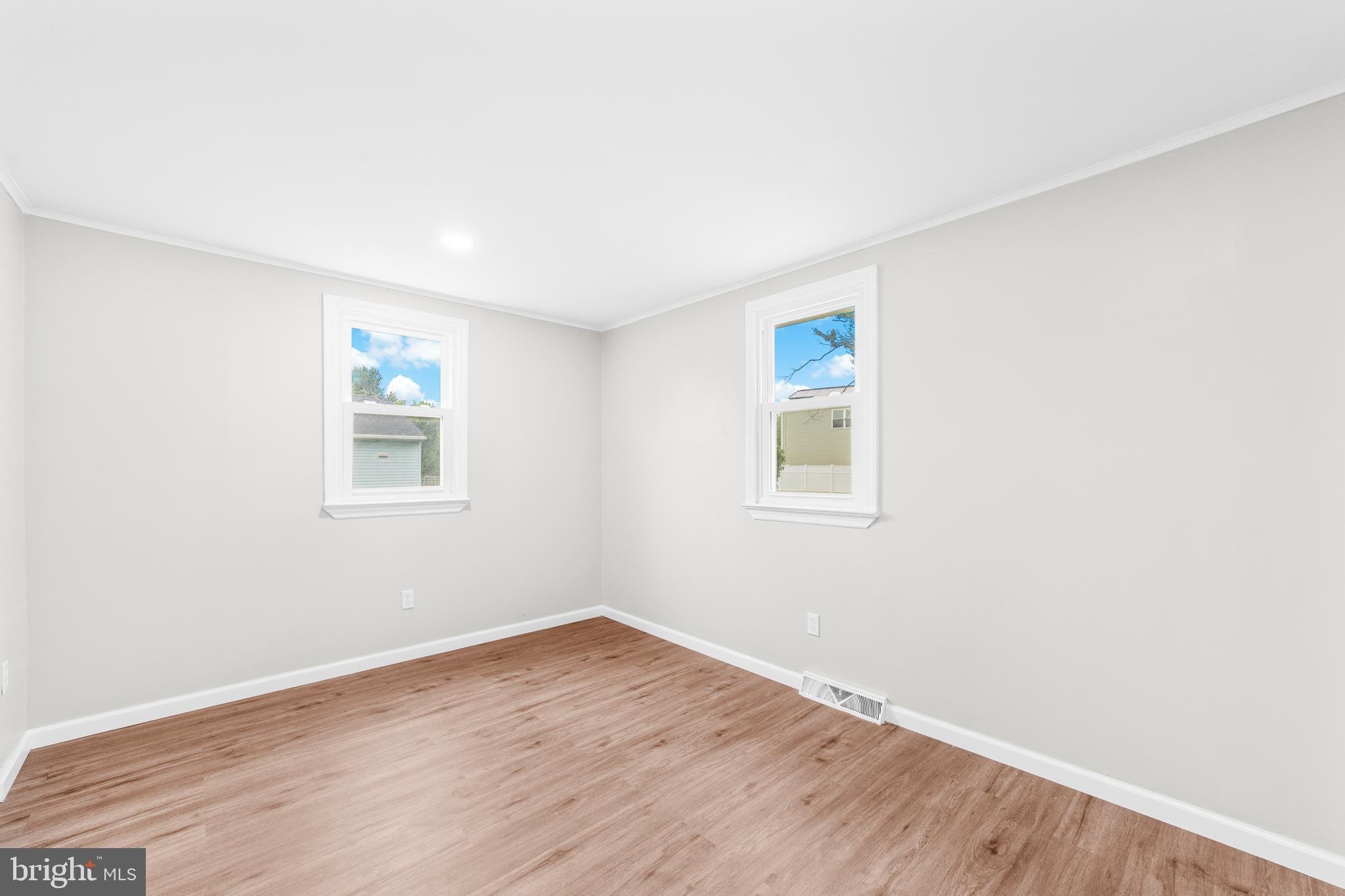 22 Alloway Road Woodstown, NJ 08098 - Photo 12 of 22 an empty room with wooden floor and window