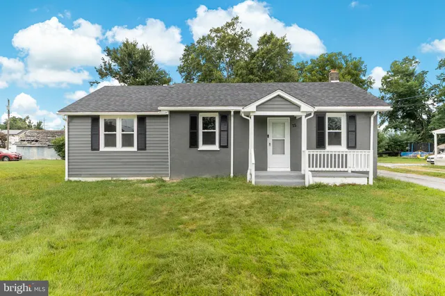 a house that has a big yard in front of it