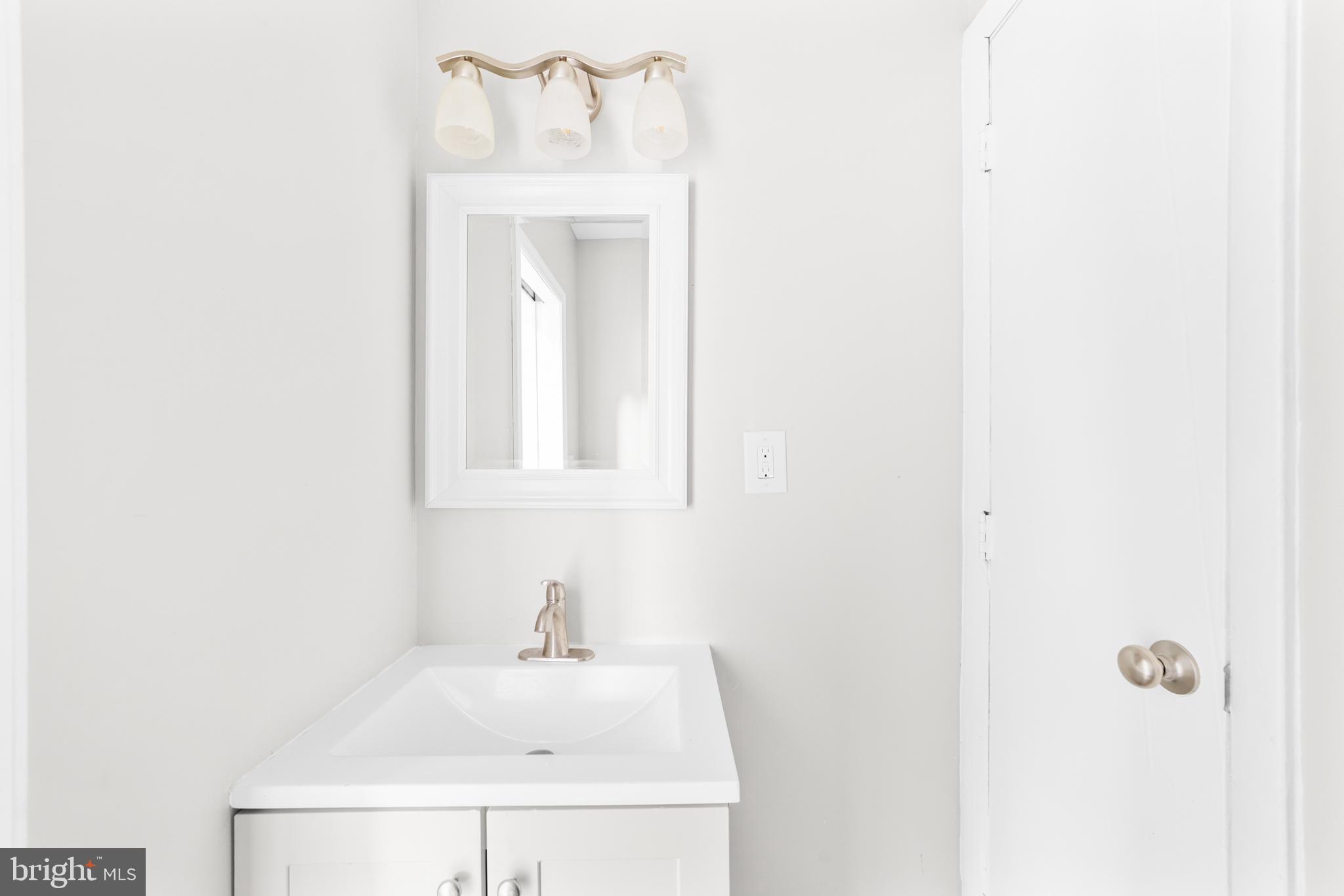 22 Alloway Road Woodstown, NJ 08098 - Photo 21 of 22 a bathroom with a sink and a mirror