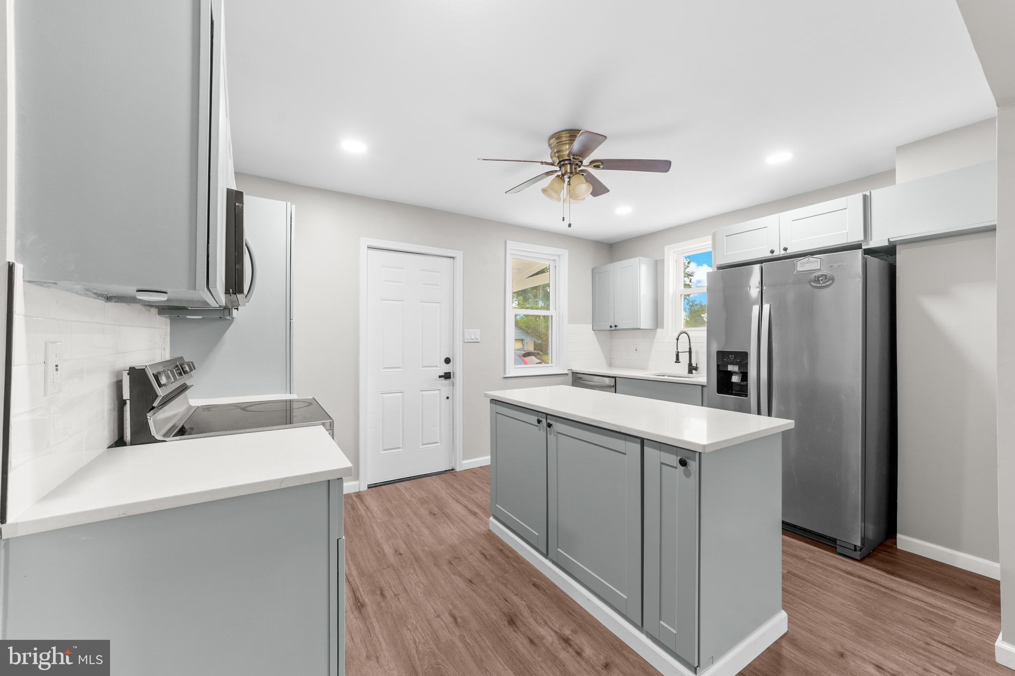 22 Alloway Road Woodstown, NJ 08098 - Photo 4 of 22 a kitchen with a sink stove and refrigerator