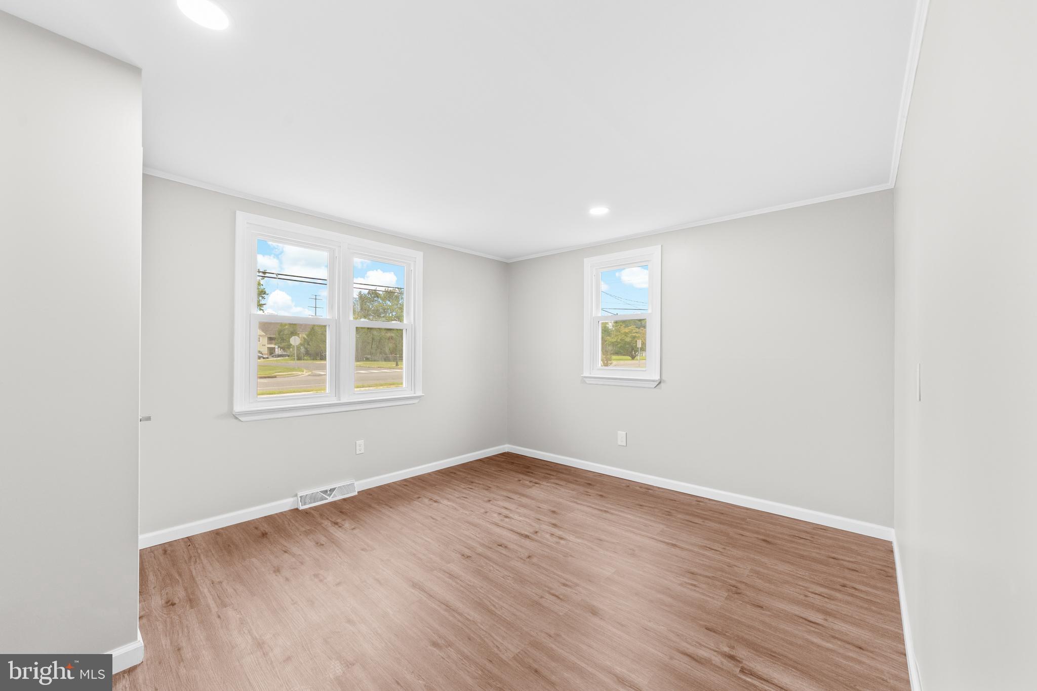 22 Alloway Road Woodstown, NJ 08098 - Photo 10 of 22 an empty room with wooden floor and windows