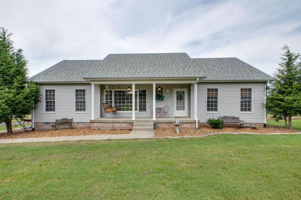 1099 Jump Off Road Bon Aqua, TN 37025 - Photo 1 of 16 front view of a house with a yard
