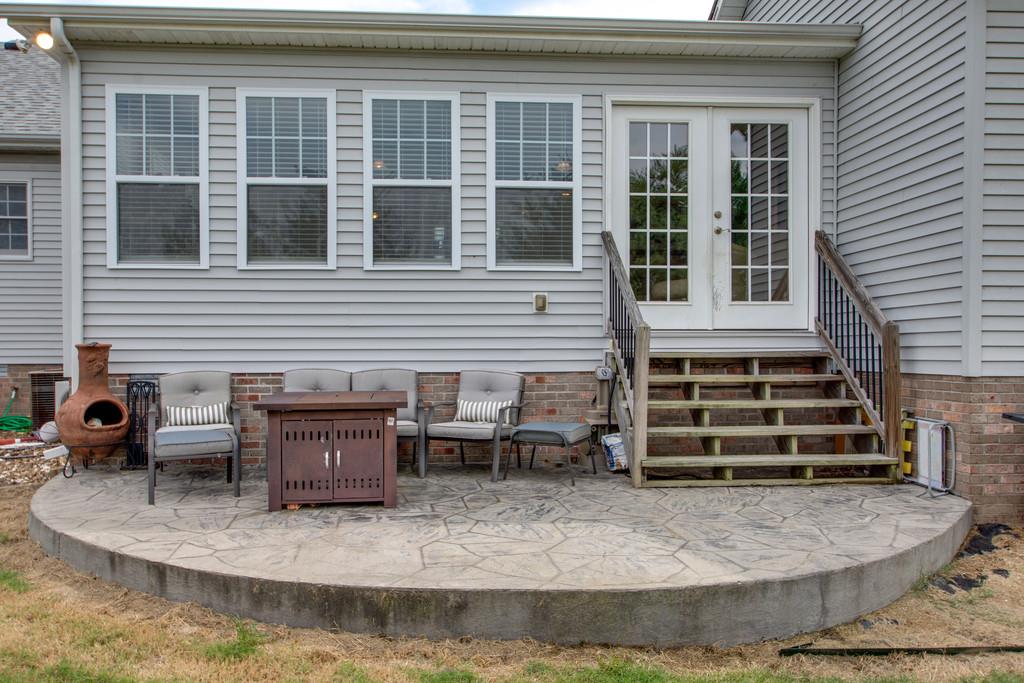 1099 Jump Off Road Bon Aqua, TN 37025 - Photo 15 of 16 a view of a house with a porch and sitting area