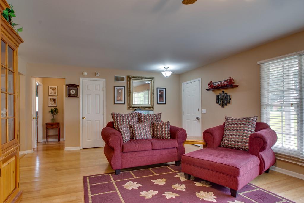 1099 Jump Off Road Bon Aqua, TN 37025 - Photo 2 of 16 a living room with furniture a rug and a window
