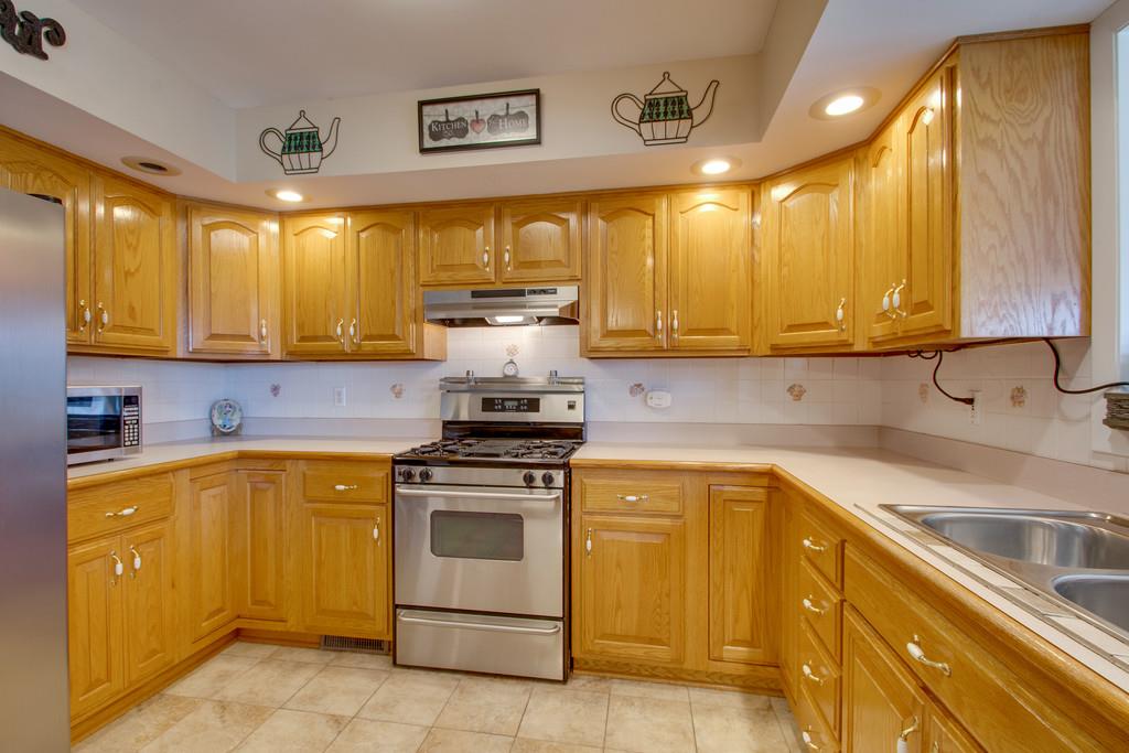 1099 Jump Off Road Bon Aqua, TN 37025 - Photo 4 of 16 a kitchen with a sink stove and cabinets
