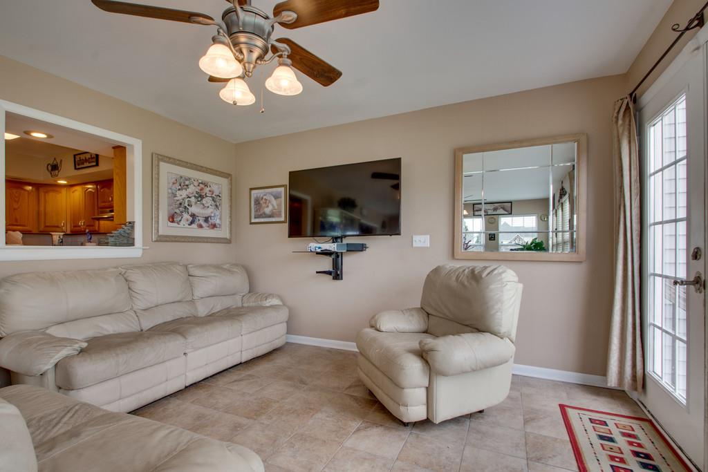 1099 Jump Off Road Bon Aqua, TN 37025 - Photo 6 of 16 a living room with furniture flat screen tv and window
