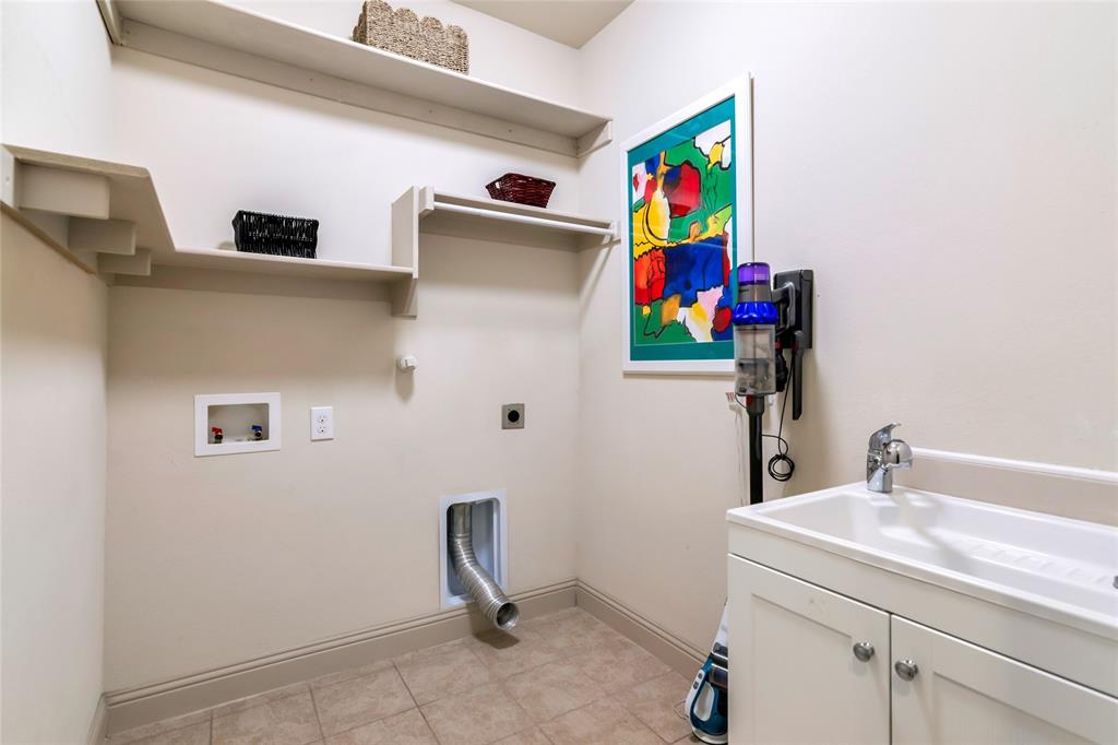 1012 Sweeping Butte Drive Fort Worth, TX 76052 - Photo 15 of 23 a bathroom with a sink and a mirror