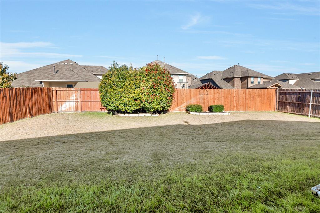 1012 Sweeping Butte Drive Fort Worth, TX 76052 - Photo 20 of 23 a view of a house with a yard
