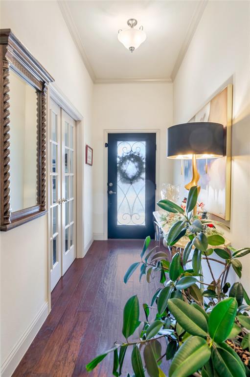 1012 Sweeping Butte Drive Fort Worth, TX 76052 - Photo 2 of 23 a hallway with a dining table and chairs