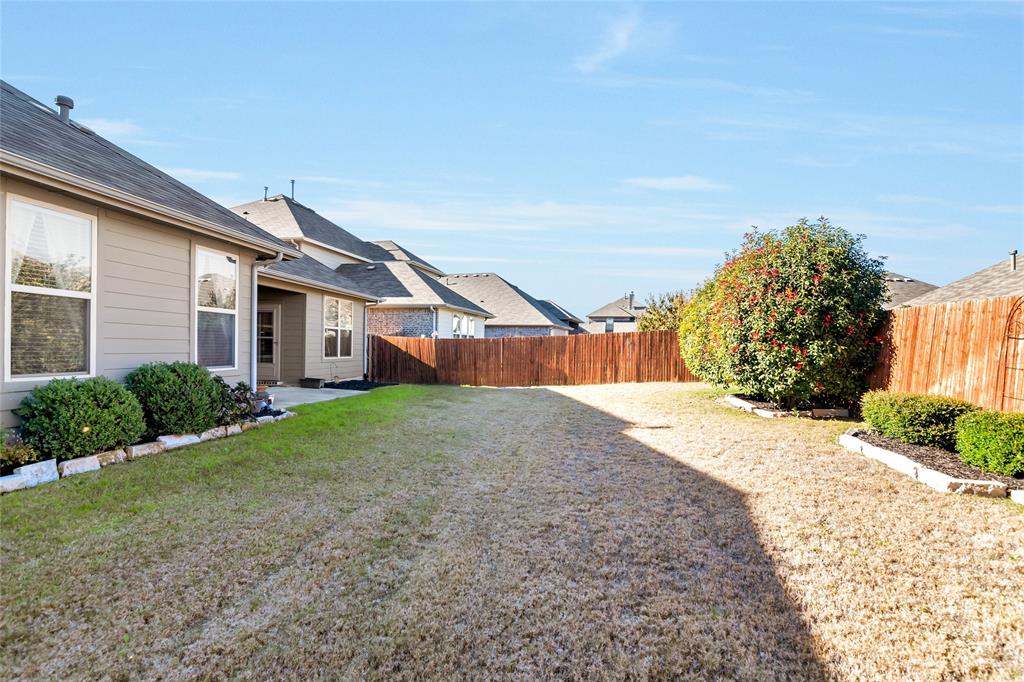 1012 Sweeping Butte Drive Fort Worth, TX 76052 - Photo 21 of 23 a front view of a house with a yard and garage