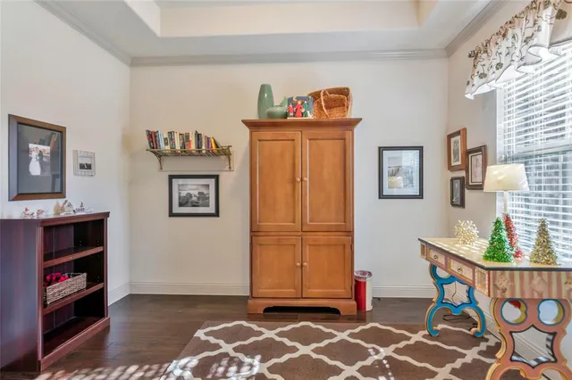 a living room with hard wood flooring and a couch