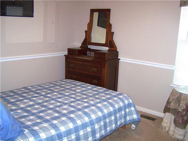 1390 Porter Morris Road Chapmansboro, TN 37035 - Photo 10 of 20 Bedroom no 2, has a built in custom murphy bed that pulls out of the wall. It remains with the sale.