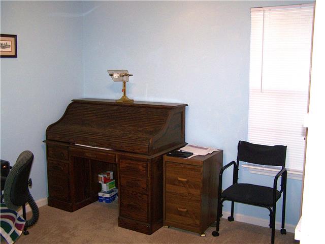 1390 Porter Morris Road Chapmansboro, TN 37035 - Photo 11 of 20 Bedroom no. 3. is currently set up as a home office. It has a walk in closet and built in book-case shelving at the opposite this picture.