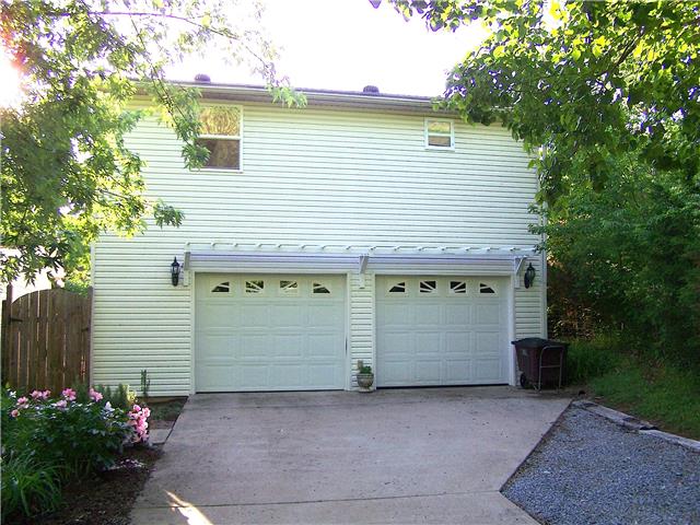 1390 Porter Morris Road Chapmansboro, TN 37035 - Photo 3 of 20 The detached two car garage, has a ample room for two automobiles and has a large semifinished expansion space above.