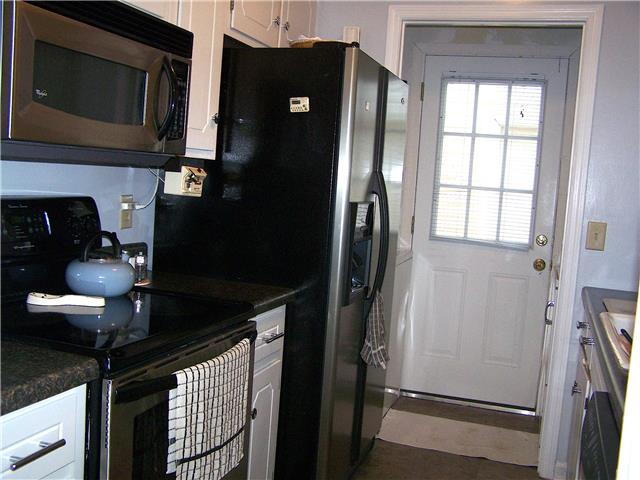 1390 Porter Morris Road Chapmansboro, TN 37035 - Photo 7 of 20 The kitchen comes equipped with stainless steel appliances. All remain including the refrigerator.