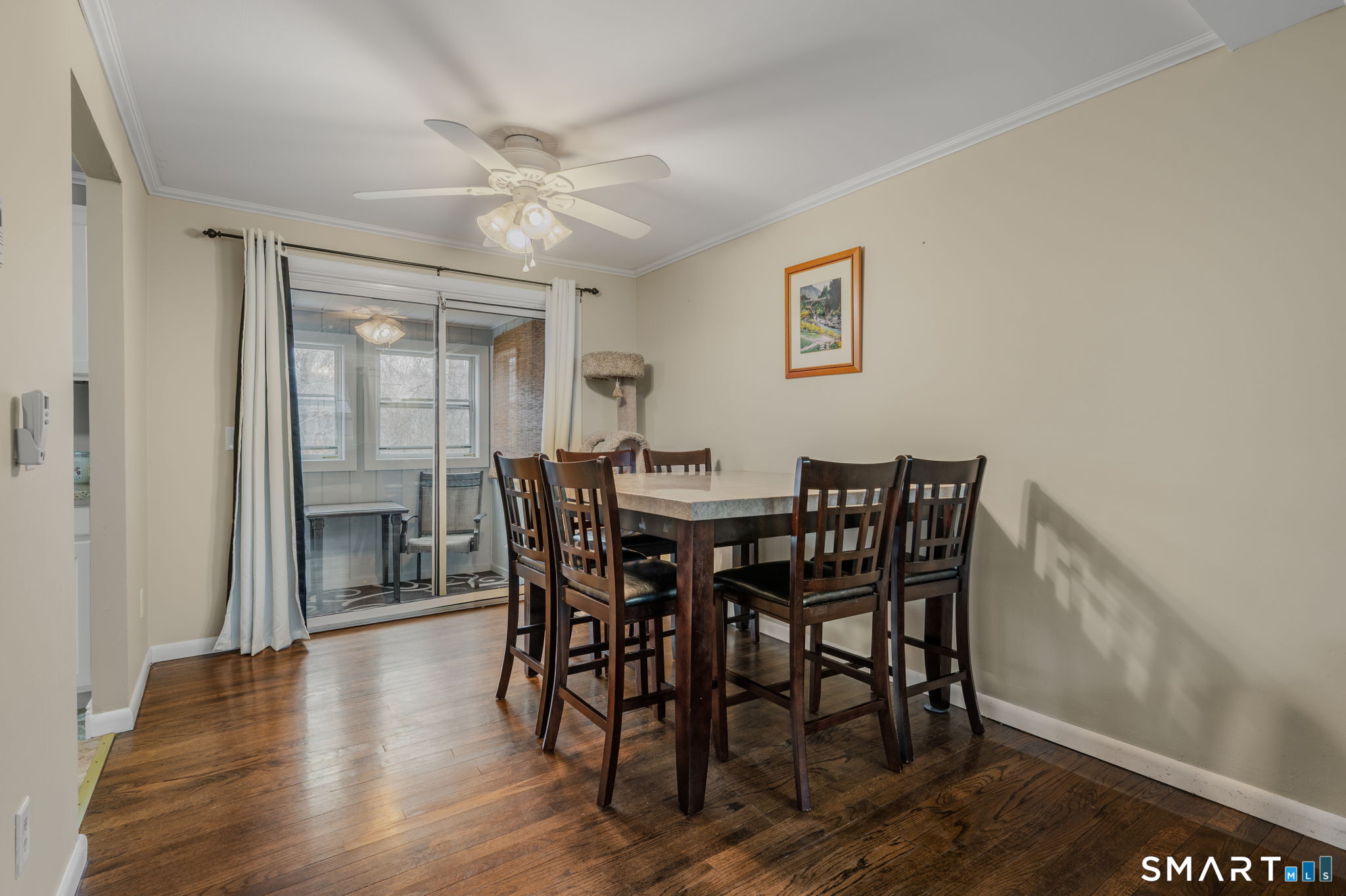 81 East Pattagansett Road, Unit 24 East Lyme, CT 06357 - Photo 12 of 29 a view of a dining room with furniture and wooden floor