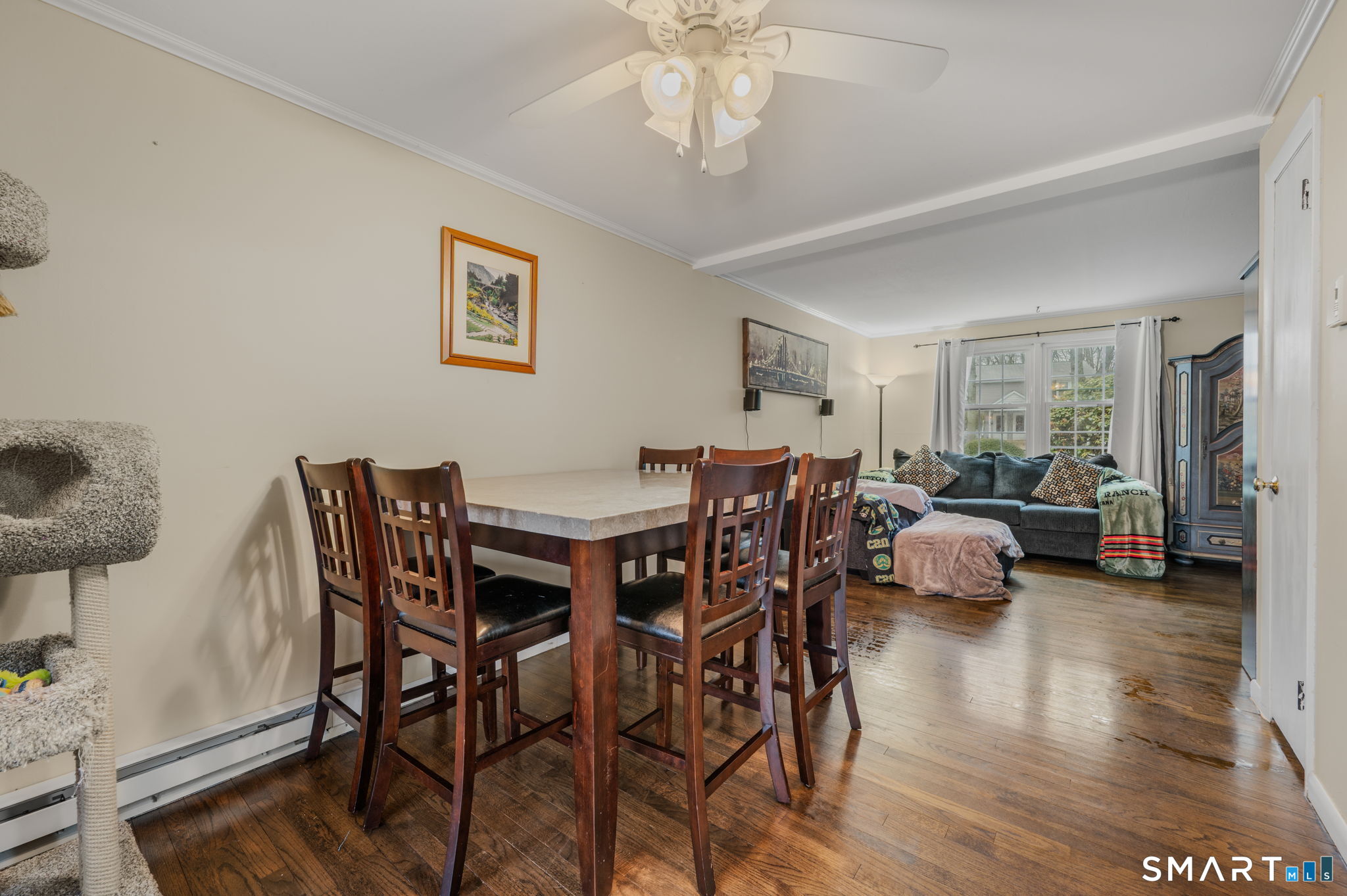 81 East Pattagansett Road, Unit 24 East Lyme, CT 06357 - Photo 13 of 29 a view of a dining room with furniture and wooden floor