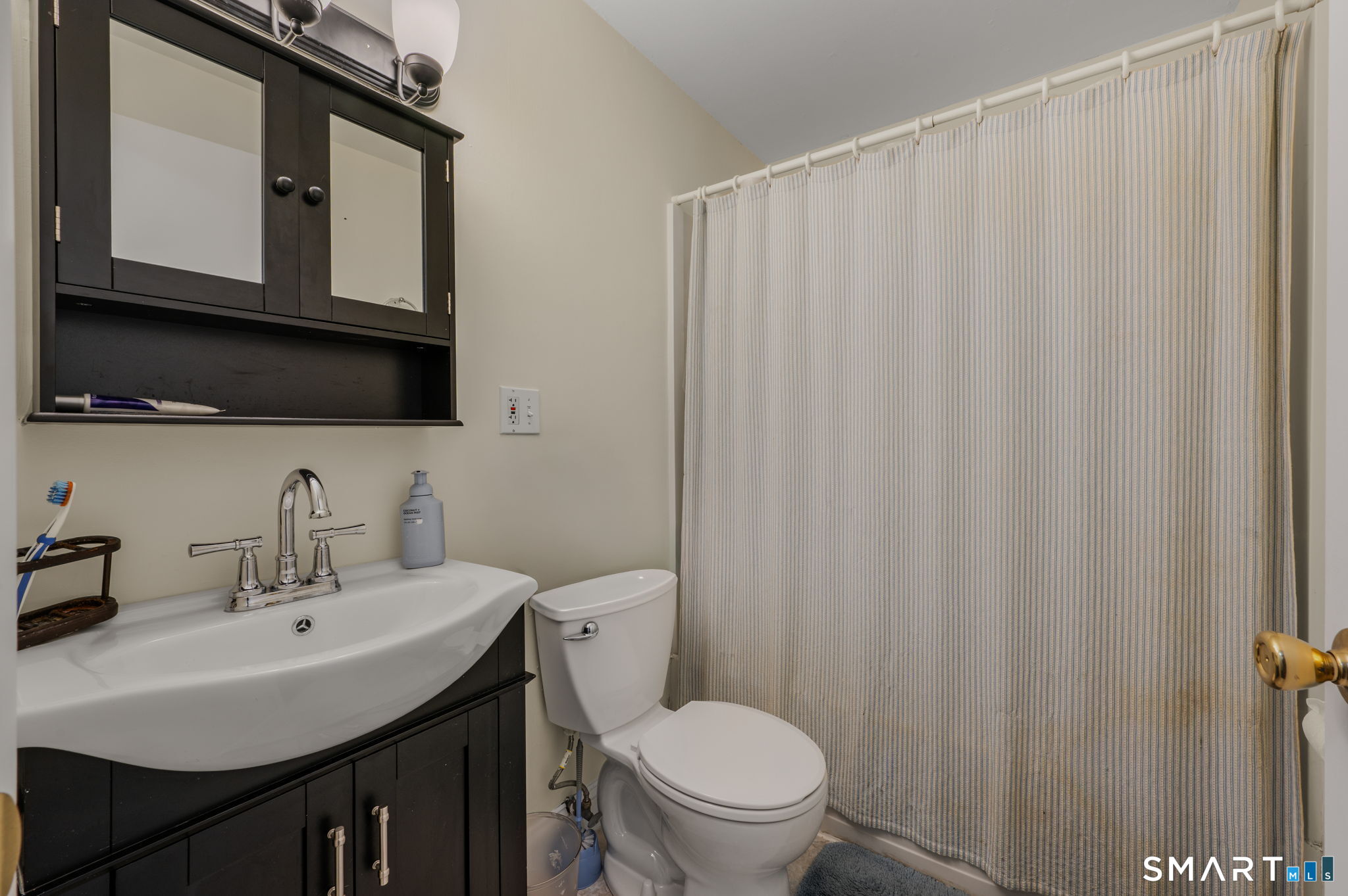 81 East Pattagansett Road, Unit 24 East Lyme, CT 06357 - Photo 16 of 29 a bathroom with a sink a toilet and shower