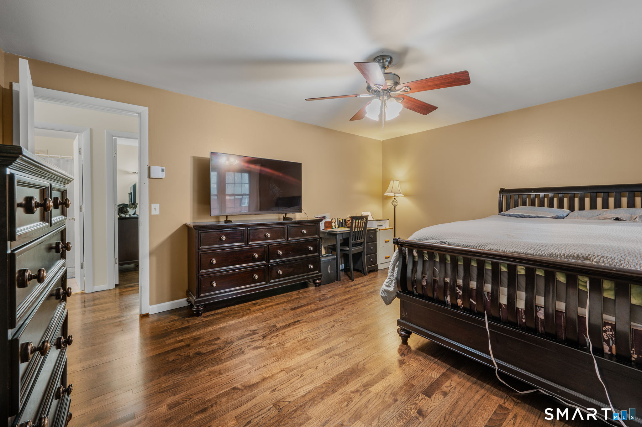 81 East Pattagansett Road, Unit 24 East Lyme, CT 06357 - Photo 18 of 29 a bedroom with furniture and a flat screen tv