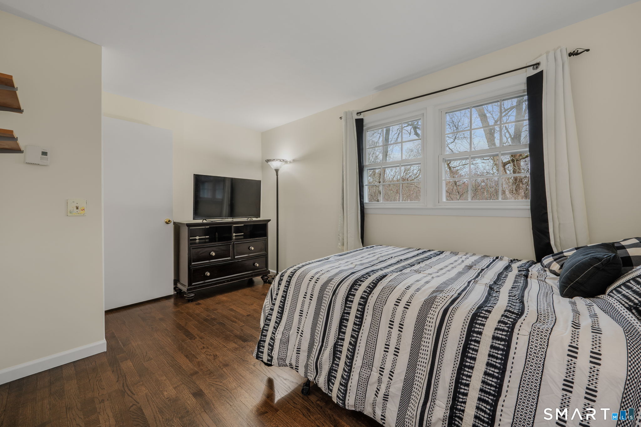 81 East Pattagansett Road, Unit 24 East Lyme, CT 06357 - Photo 21 of 29 a bedroom with a bed and a television