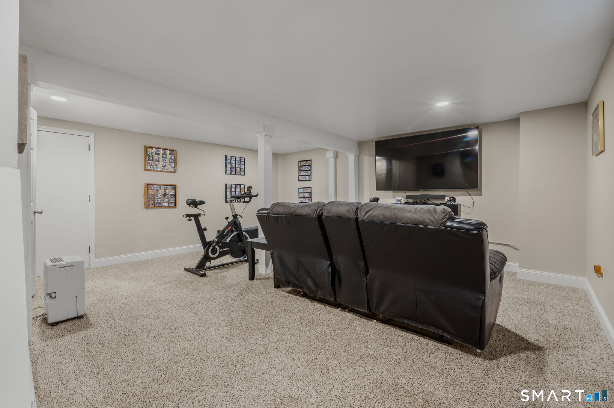 81 East Pattagansett Road, Unit 24 East Lyme, CT 06357 - Photo 23 of 29 a view of a livingroom with furniture and a window