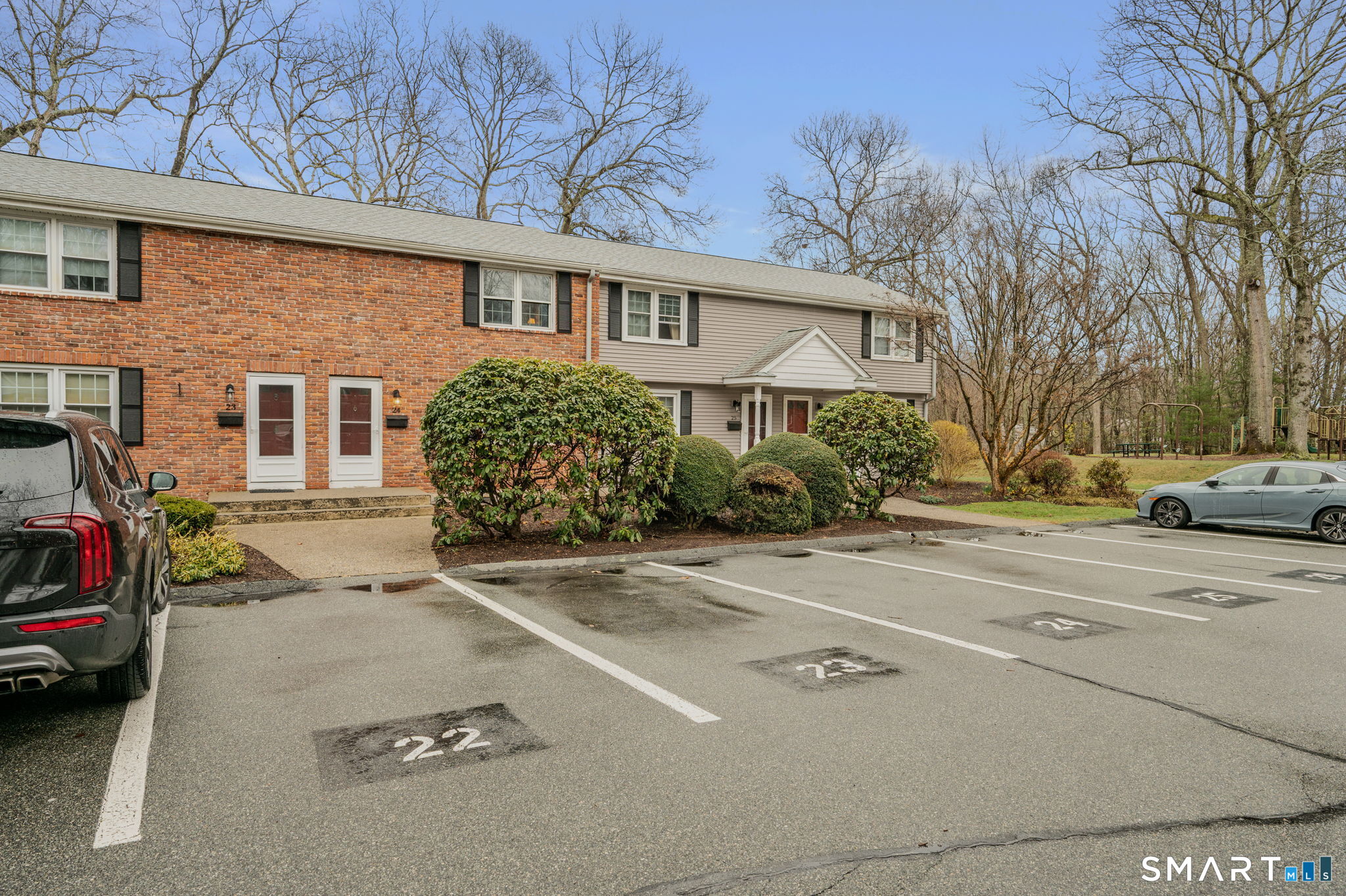 81 East Pattagansett Road, Unit 24 East Lyme, CT 06357 - Photo 3 of 29 a view of a street that has couple of cars parked on the road