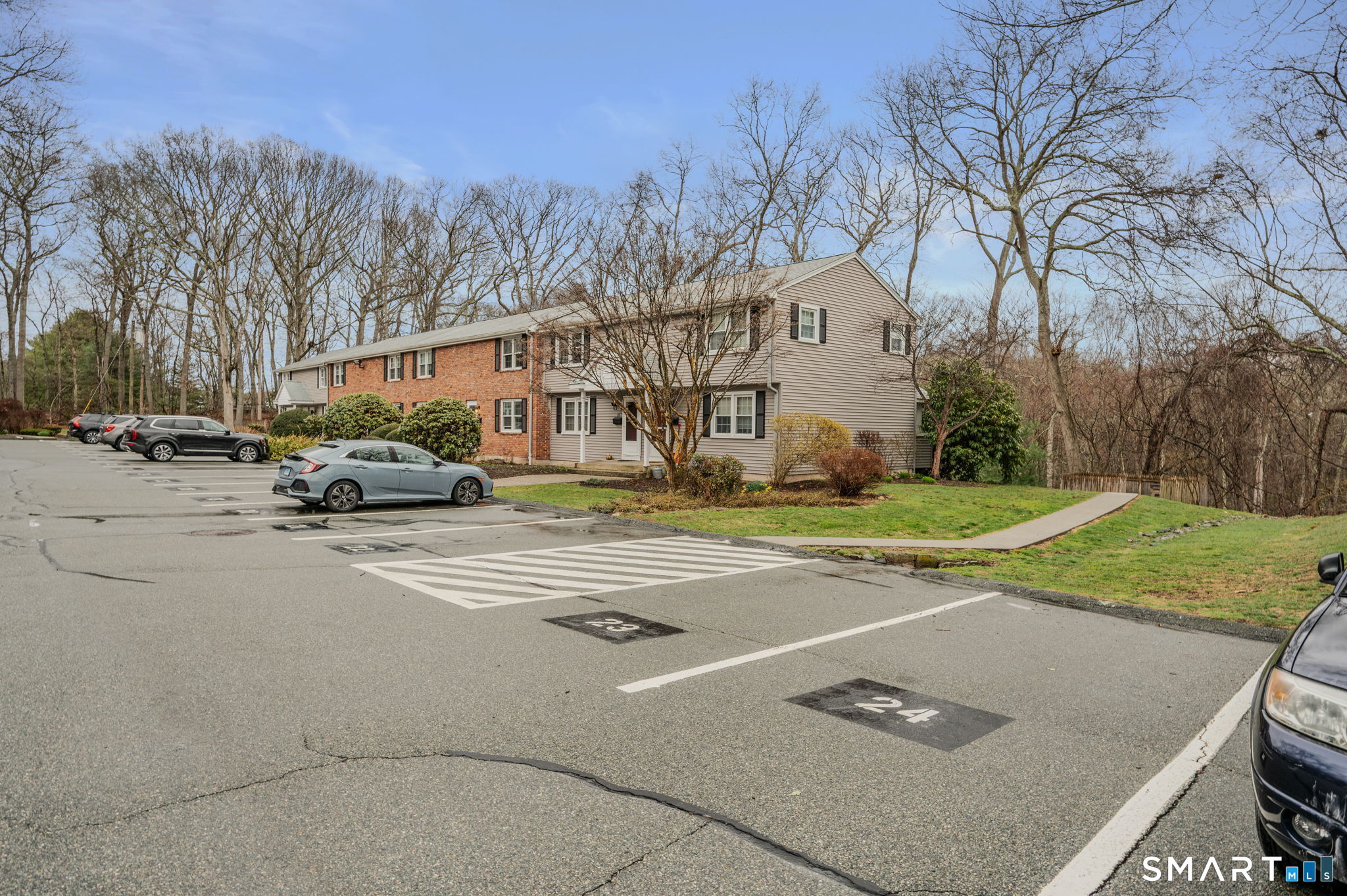 81 East Pattagansett Road, Unit 24 East Lyme, CT 06357 - Photo 4 of 29 a view of a street with houses