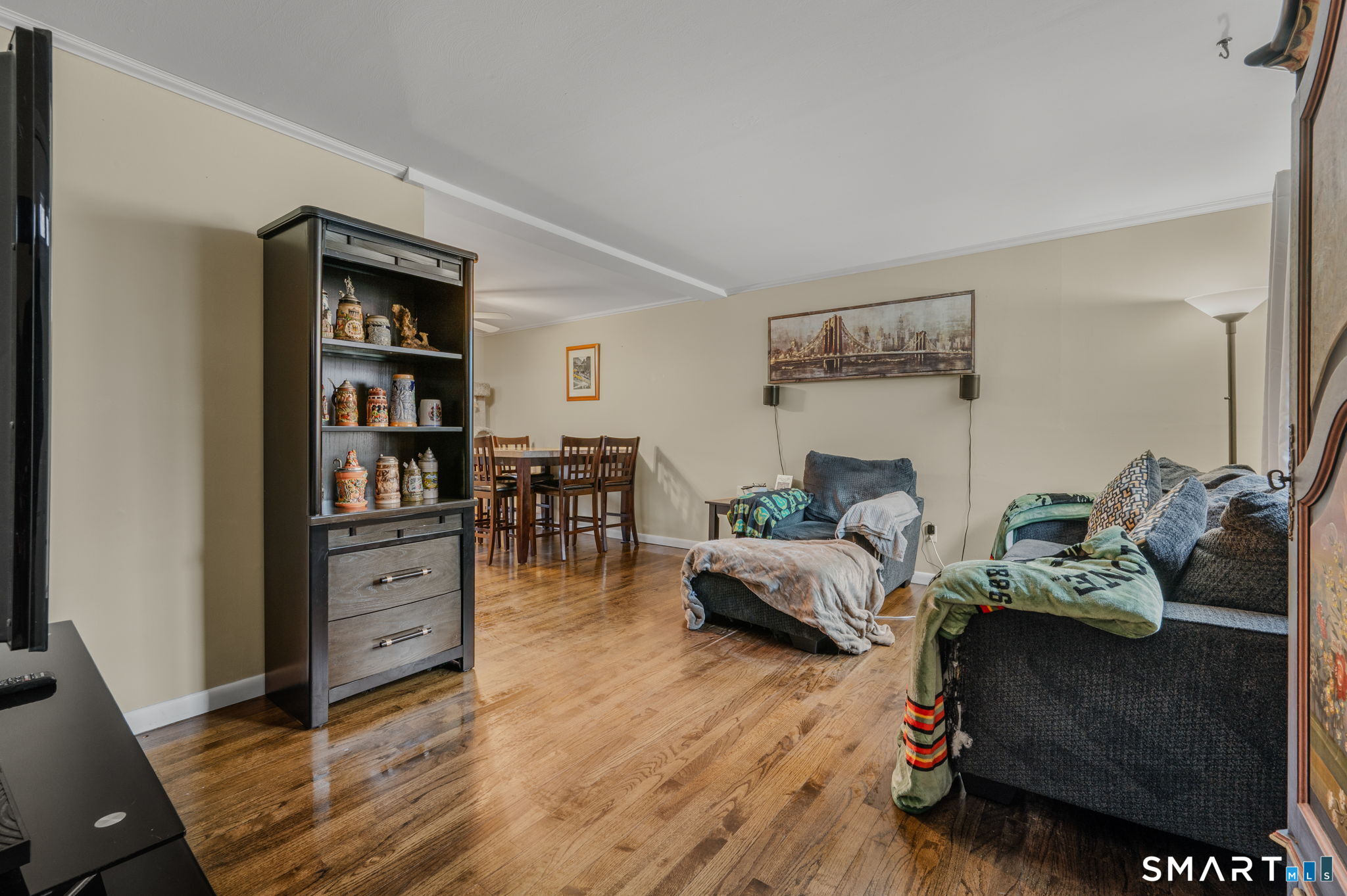 81 East Pattagansett Road, Unit 24 East Lyme, CT 06357 - Photo 8 of 29 a living room with furniture cabinets and wooden floor