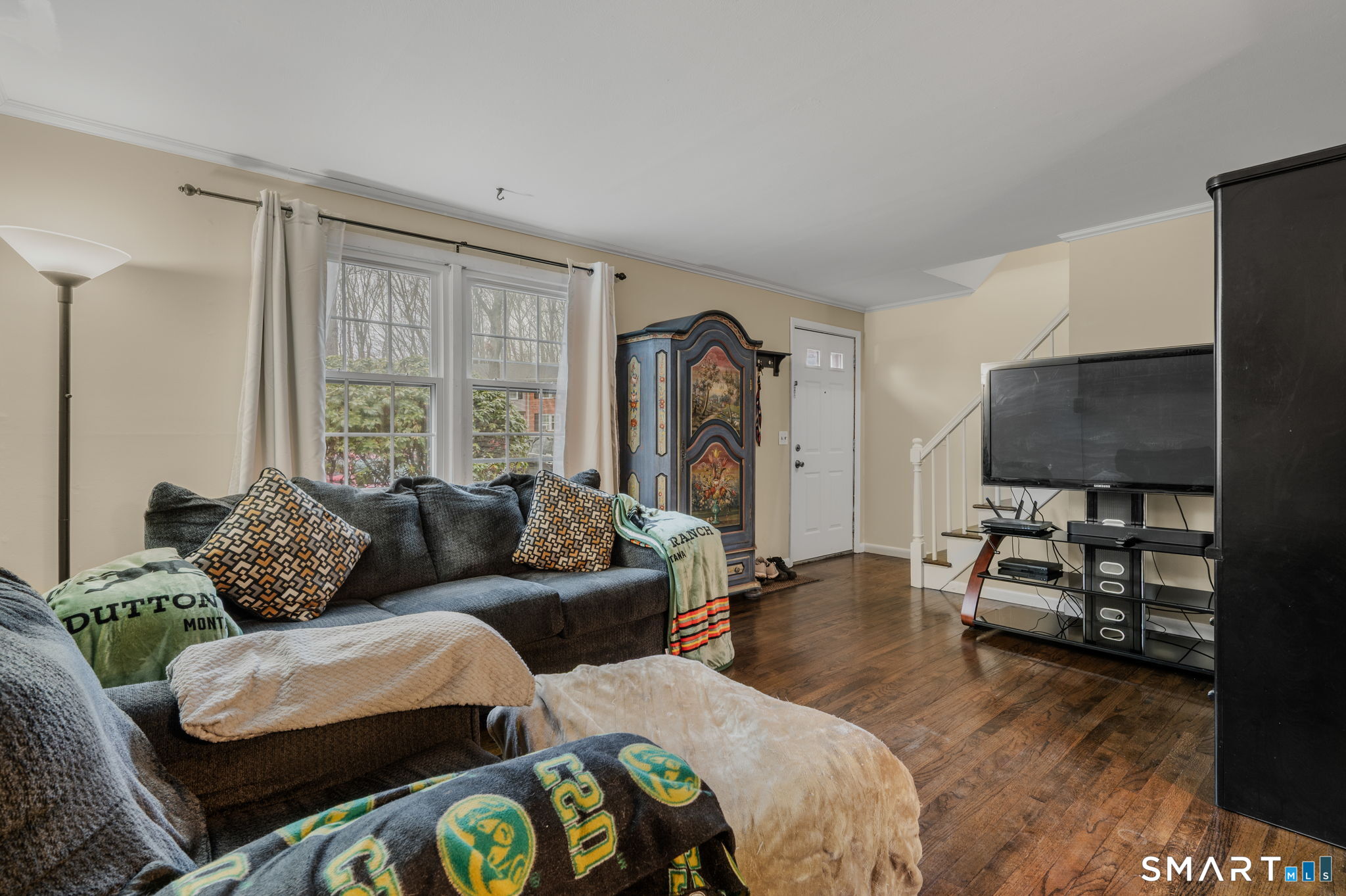 81 East Pattagansett Road, Unit 24 East Lyme, CT 06357 - Photo 10 of 29 a living room with furniture and a flat screen tv