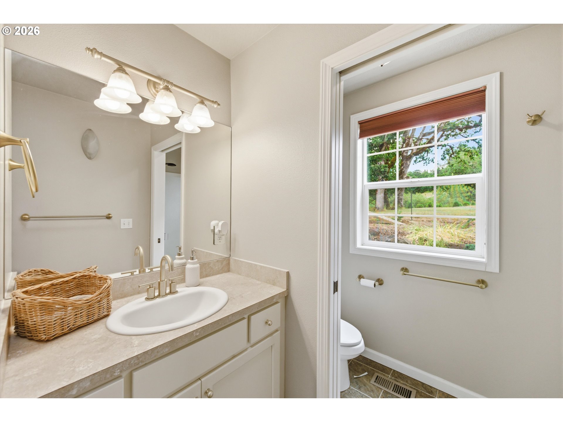 13880 McCaleb Road Monmouth, OR 97361 - Photo 25 of 44 a bathroom with a double vanity sink and a mirror