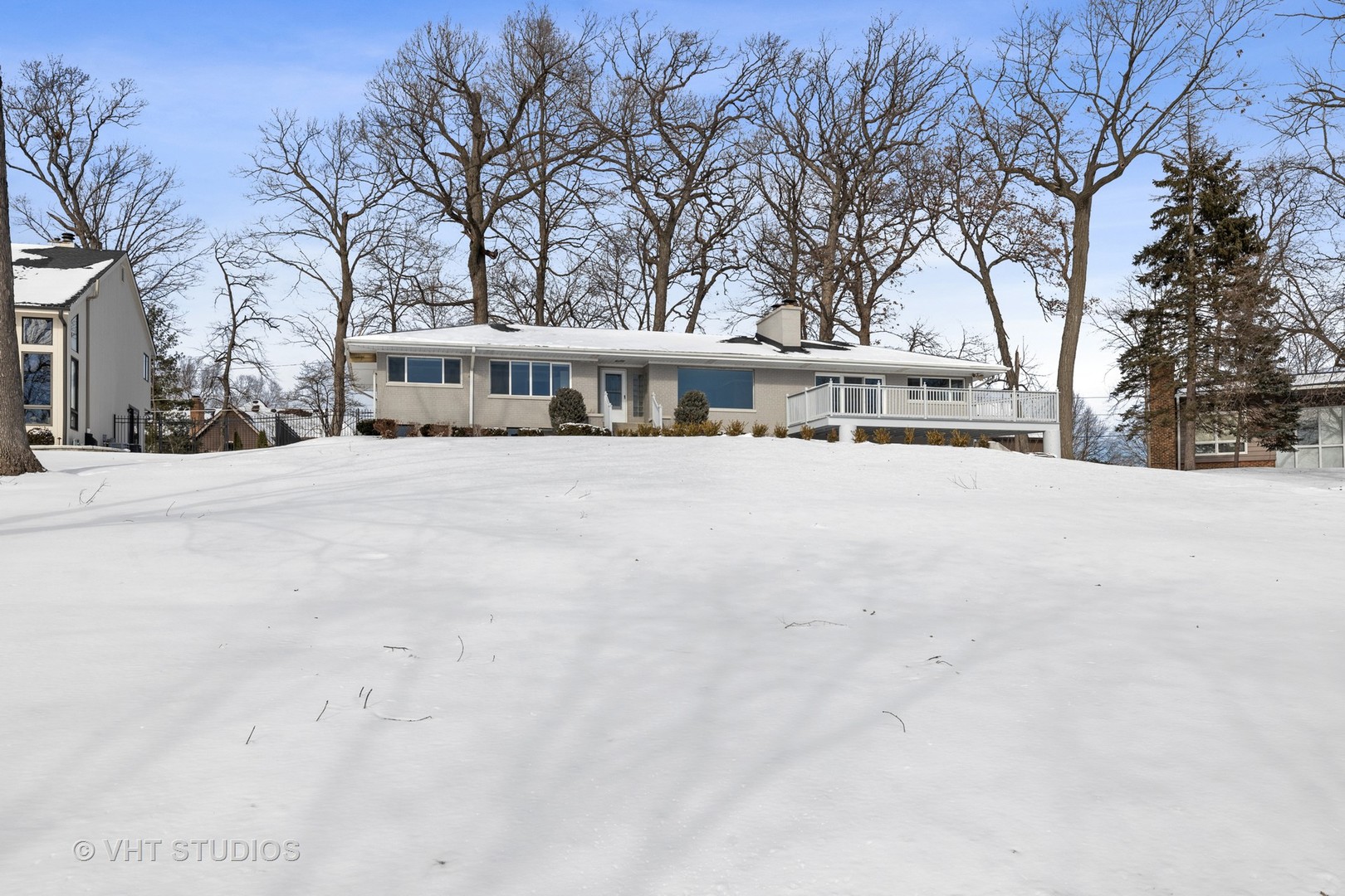 21-w064 Shelley Drive Itasca, IL 60143 - Photo 3 of 24 a view of a house with snow on the road