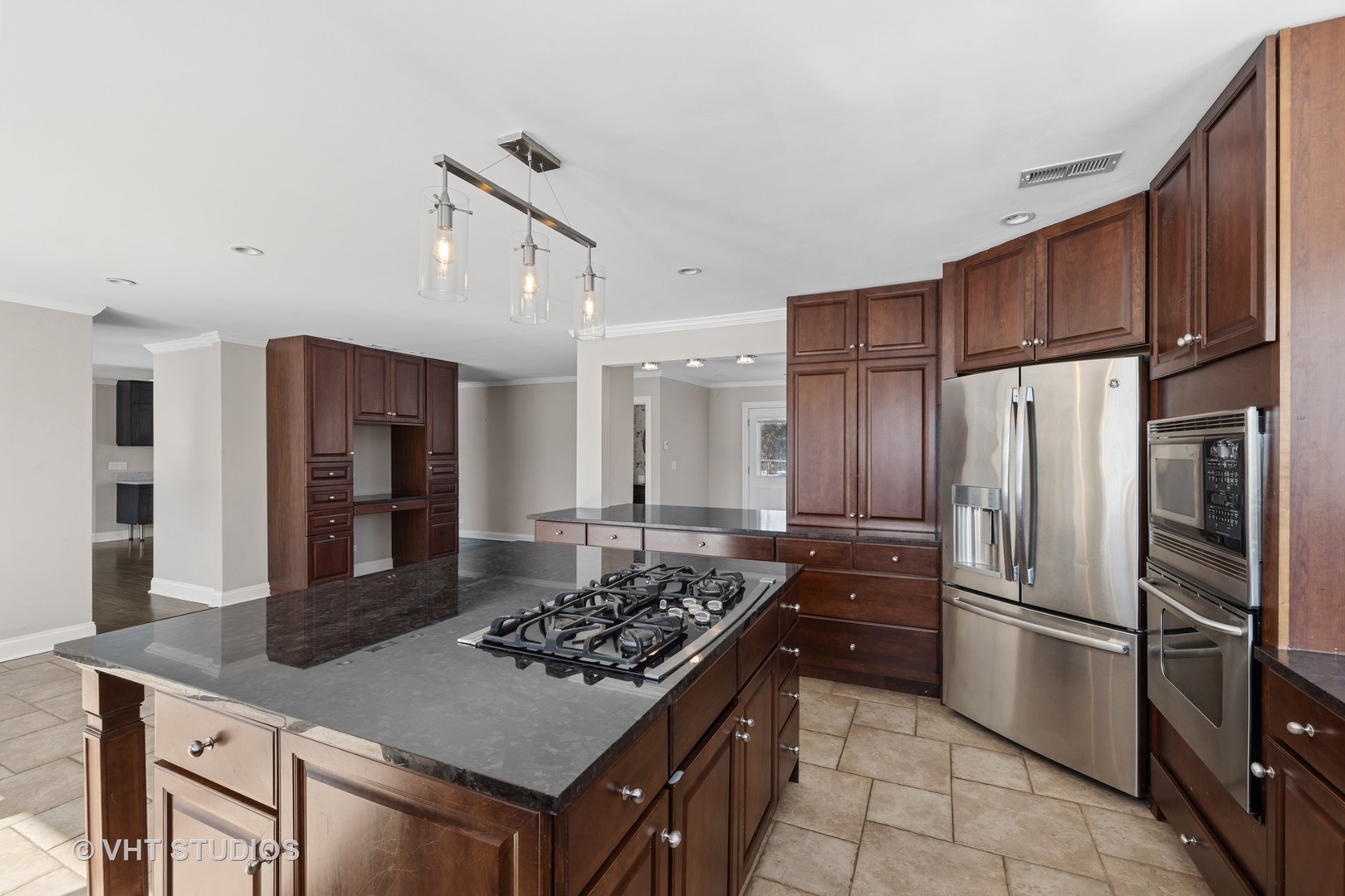 21-w064 Shelley Drive Itasca, IL 60143 - Photo 9 of 24 a kitchen with stainless steel appliances granite countertop a sink stove and refrigerator