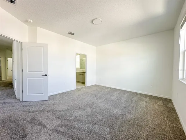 an empty room with closet area