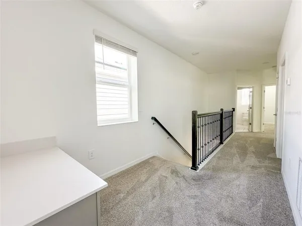 a view of a hallway with staircase