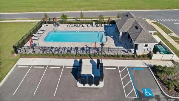 swimming pool view with a outdoor seating space