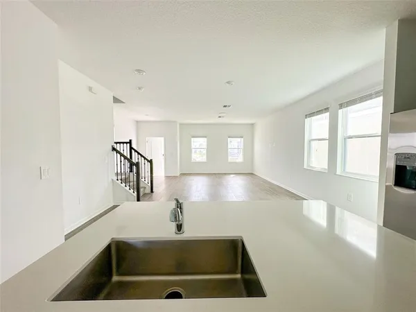 a view of an empty room with windows