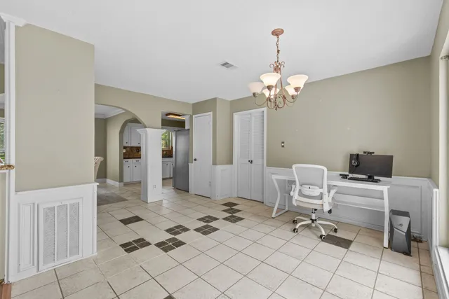 a view of a livingroom with a lounge chair and painted walls