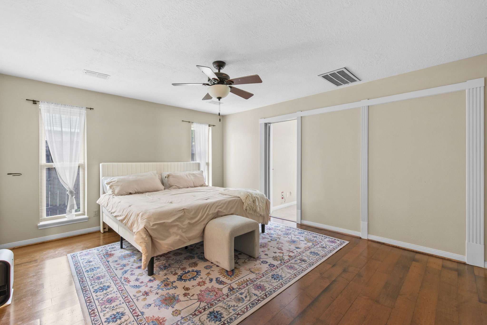 5507 Glenmere Lane Spring, TX 77379 - Photo 20 of 37 a bedroom with a bed and wooden floor