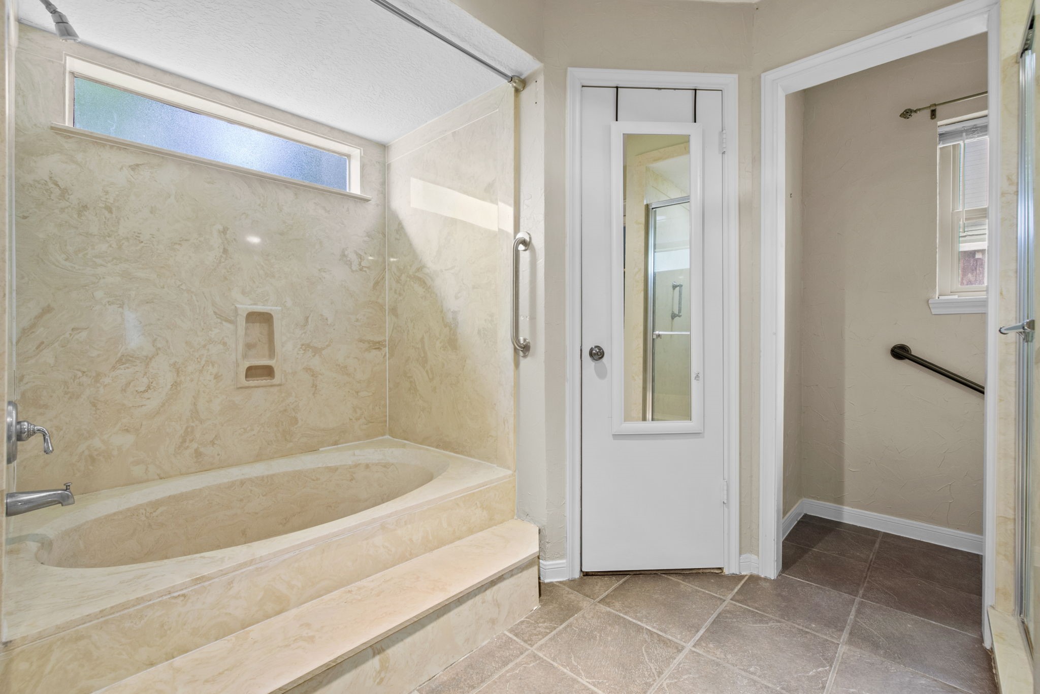 5507 Glenmere Lane Spring, TX 77379 - Photo 23 of 37 a bathroom with a bathtub and a shower