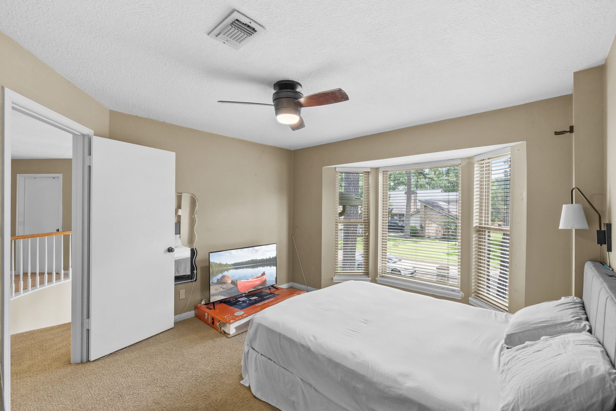 5507 Glenmere Lane Spring, TX 77379 - Photo 27 of 37 a bedroom with a bed and large window