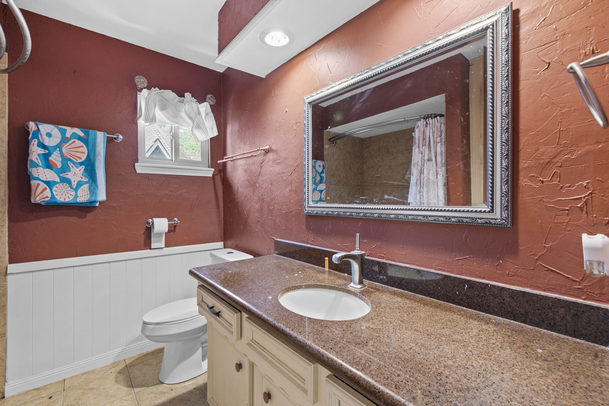 5507 Glenmere Lane Spring, TX 77379 - Photo 29 of 37 a bathroom with a toilet a sink and mirror