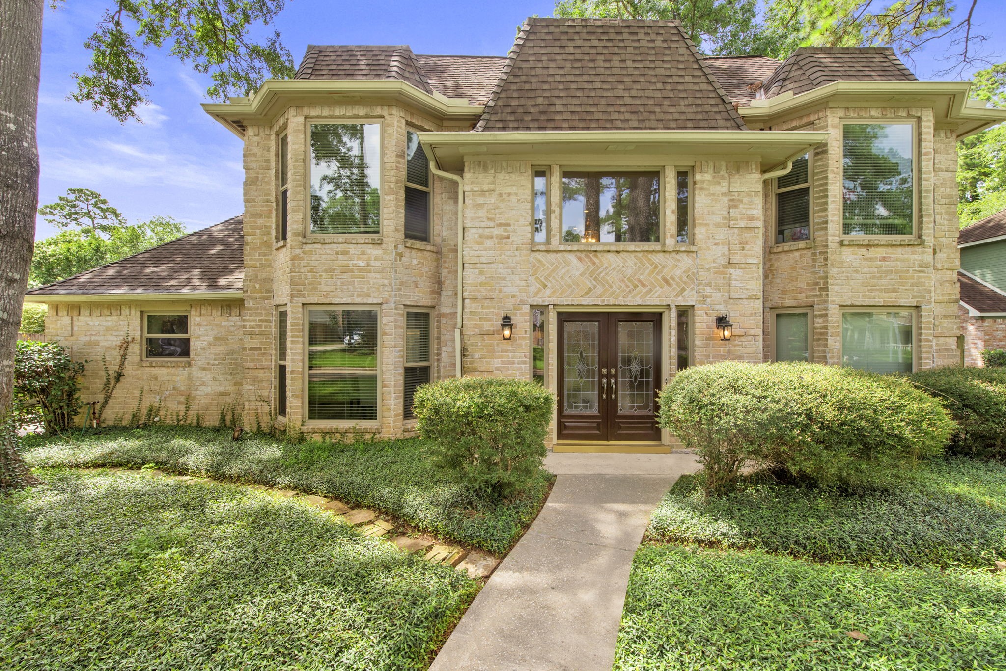 5507 Glenmere Lane Spring, TX 77379 - Photo 3 of 37 front view of a brick house with a yard