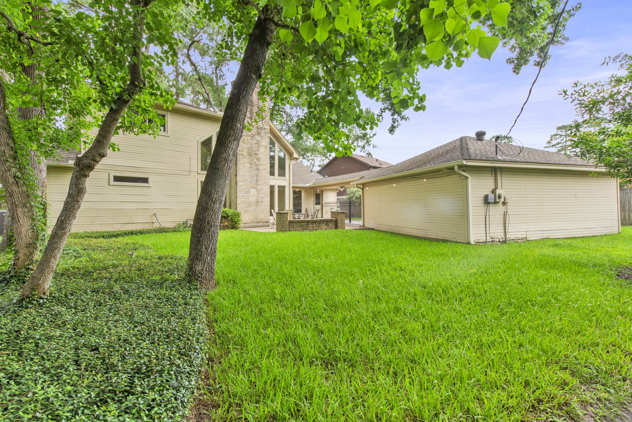 5507 Glenmere Lane Spring, TX 77379 - Photo 34 of 37 a view of a house with a yard and a large tree