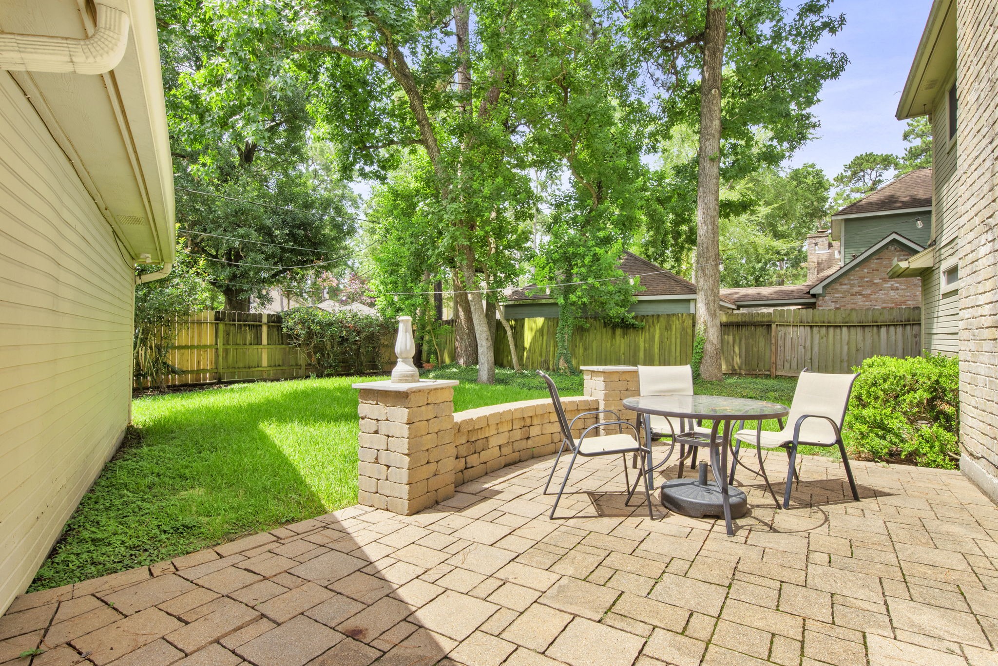 5507 Glenmere Lane Spring, TX 77379 - Photo 36 of 37 a view of a chairs and table in backyard of the house
