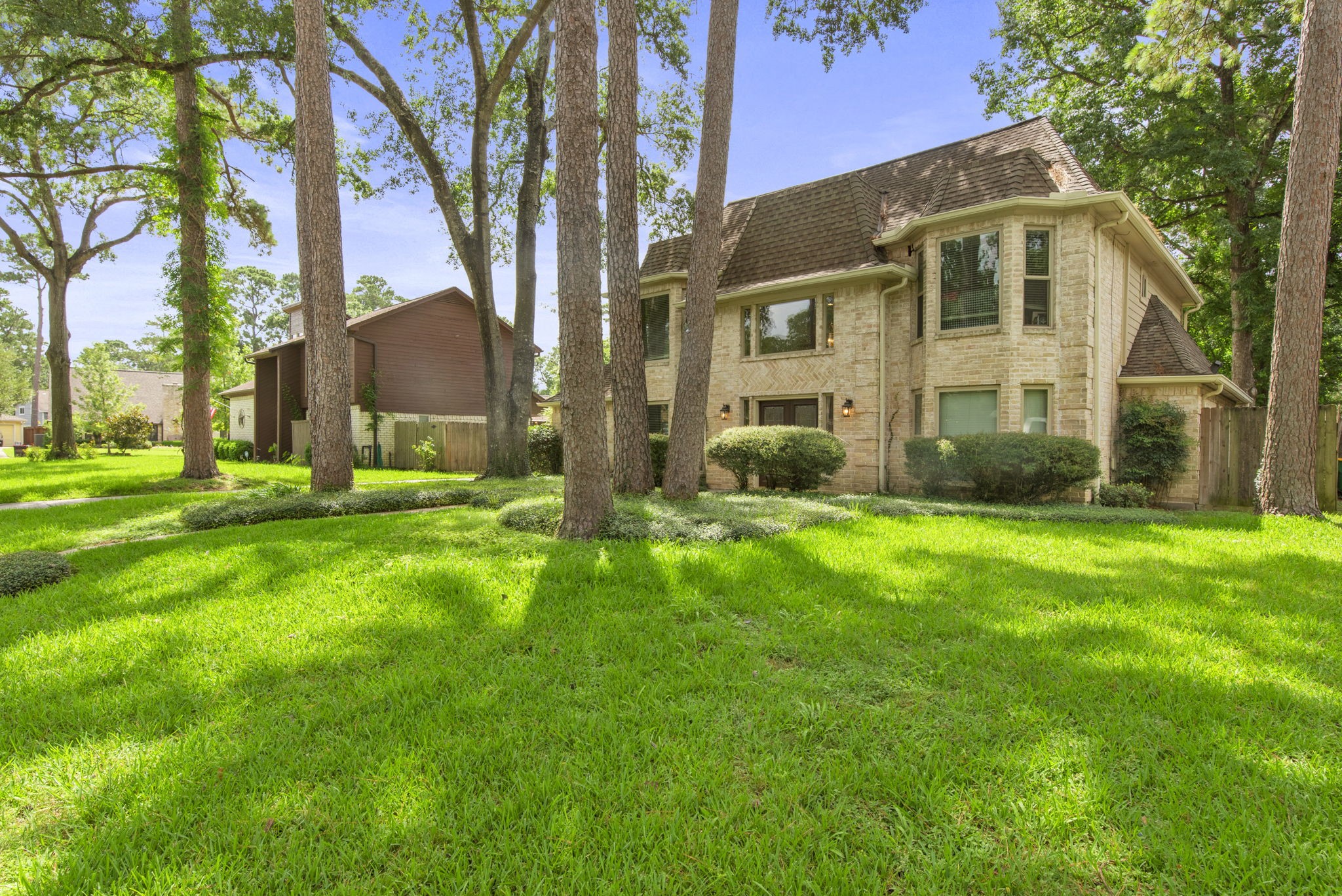 5507 Glenmere Lane Spring, TX 77379 - Photo 6 of 37 a front view of a house with a yard and trees