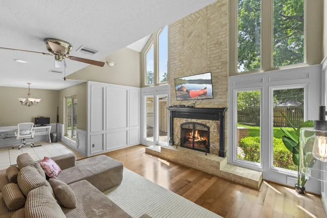 a living room with furniture and a fireplace
